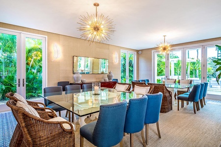 Gather and enjoy your meals in the elegant dining area with two tables for ten.
