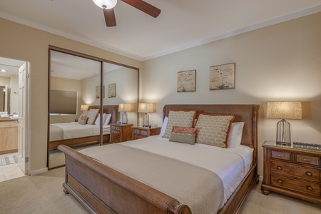 The spacious primary bedroom with a king bed.