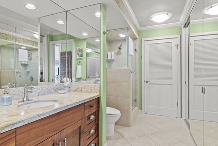 Luxurious bathroom with dual sinks and a spacious shower.