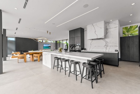 Gather around the oversized island and enjoy effortless entertaining in a chef-inspired kitchen.
