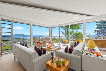 Elegant dining room with statement chandelier and contemporary island décor.