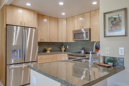 Enjoy modern conveniences in the full kitchen, complete with granite countertops and stainless steel appliances.