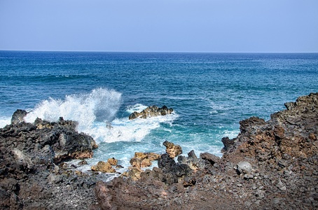 People and cruise ship watch from the Kailua-Kona Pier, where you'll have access to Hawaii's best scuba diving, big-game fishing, kayaking, and dolphin and whale watching.