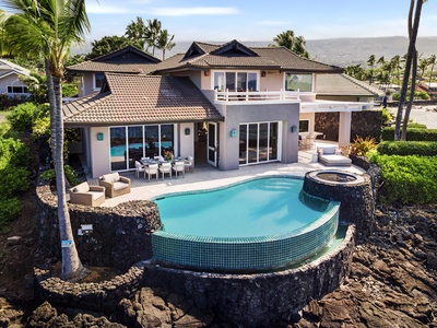 Evening dining on the lanai as the light softens across the Kona coast.