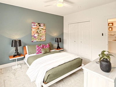 Your stylish bedroom features crisp linens, vibrant artwork, and modern touches that create the perfect retreat for restful nights.