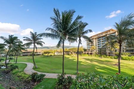 Living room at Honua Kai Konea 204 with comfy seating and lanai access.