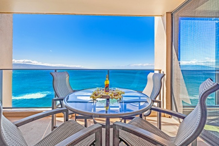 This oceanfront balcony provides a perfect setting for enjoying a refreshing drink while soaking in panoramic views of the Pacific.