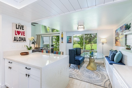 Open-concept layout connects kitchen, dining, and living in a bright, social space.