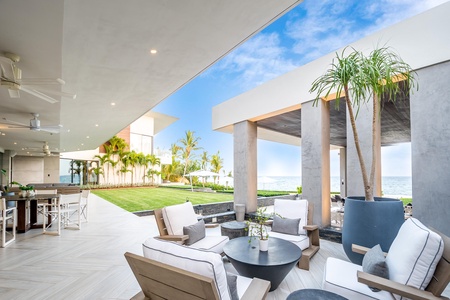 Unwind in this stylish open-air lounge area with plush seating, enjoying views of Dominican Republic.