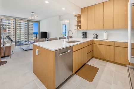 Open-concept kitchen with a dishwasher and ample counter space.