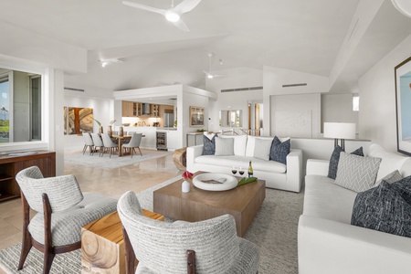 Wind down in your spacious open-plan living area with plush seating, elegant dining space, and modern kitchen.