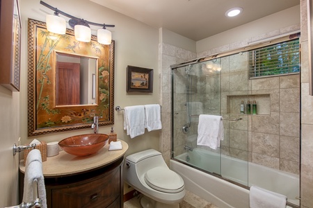 The second bathroom features modern fixtures and a shower/tub combo.