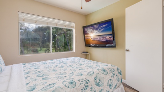 Wake up to garden views from your cozy bedroom, complete with a wall-mounted TV for relaxing evenings in.
