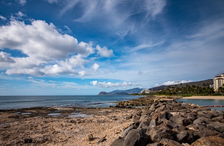 An ocean adventure with sand weathered rock formations.