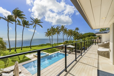 Elevated lanai overlooking the pool and ocean, a serene perch for morning coffee or evening sunsets.