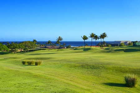 Golf course and ocean views stretching across Kauai’s sunny South Shore.