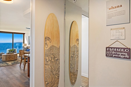Mahana 1118 features coastal charm with custom surfboard art bringing island vibes indoors.