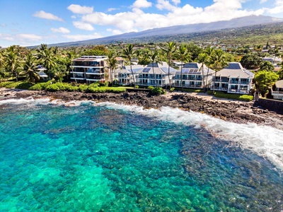 Aerial view of Hale Kai O’Kona’s dramatic coastline setting and resort edge.