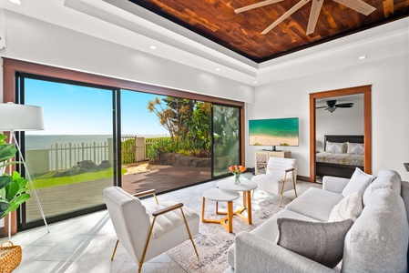 Bright and airy living room with large sliding glass doors opening to the garden.