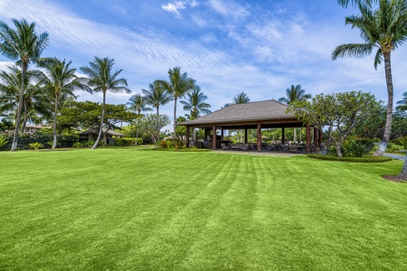 A spacious green space near the community pavilion—perfect for family games, yoga stretches, or letting little ones run free.