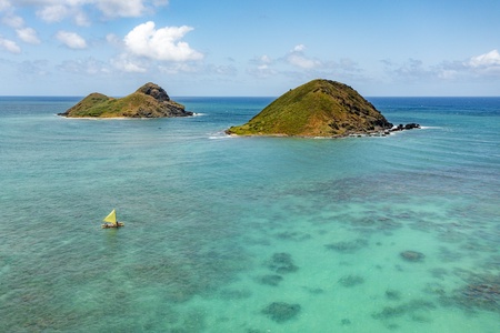Breathtaking aerial perspective of the Mokulua Islands and pristine beach views.