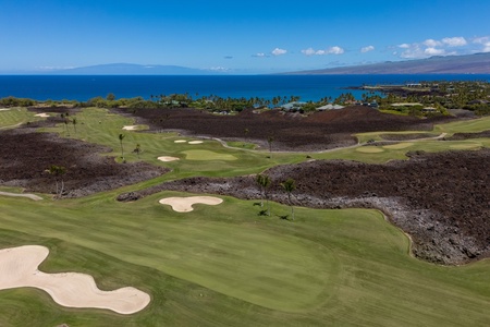 This stunning aerial view showcases the adjacent golf course.