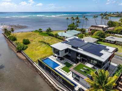 Private oceanfront estate with pool, lawn, and direct coastal setting.