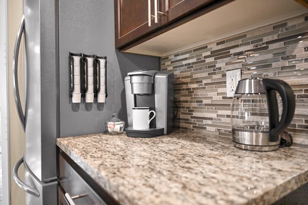 Jumpstart your mornings with a convenient coffee bar equipped with both drip and Keurig machines, plus precision-cut knives.