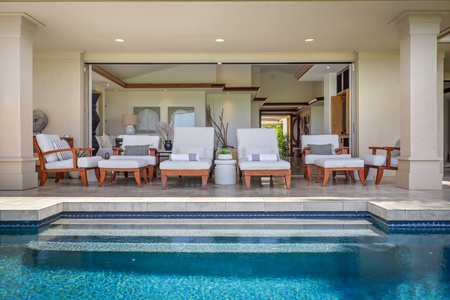 Interior entrance walkway with lush tropical landscaping.