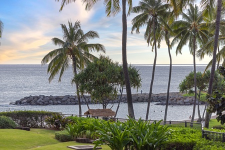 Oceanfront setting with swaying palms, a protected cove, and a peaceful gazebo pier—perfect for soaking in tropical island views.