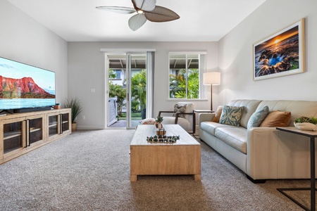 Seamless living in the beautifully furnished living room that overlooks the lanai