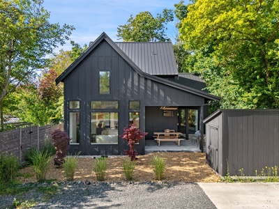 Modern creekside charm at The Black Squirrel—your peaceful base near Fairhaven Village and scenic trails.
