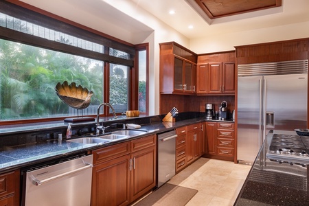 Fully equipped kitchen with stainless appliances.