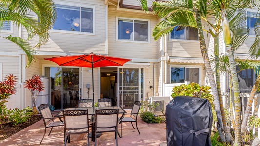 A view outside of this charming stay under sun dappled palms.