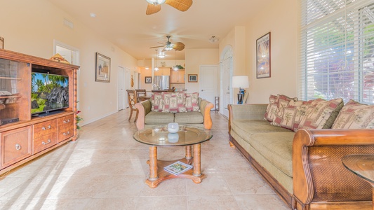 Seamless living in the beautifully furnished living room with a television and a view.