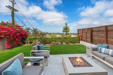 Gather and enjoy the fire pit and the lush garden views.