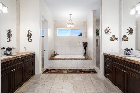Pamper yourself in the ensuite with a tub, dual vanities, and walk-in showers.
