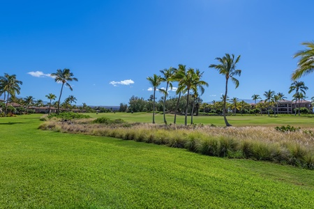 Enjoy open green space and tropical landscaping from your villa’s lanai—ideal for kids to play or relaxing with a book.