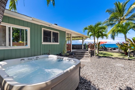 Backyard hot tub for a soothing soak beneath swaying palms.