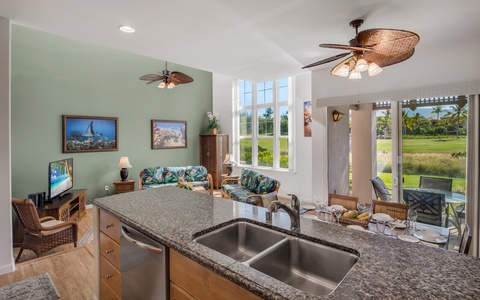 The kitchen's central island overlooks the living room, inviting conversation and connection while you prep or serve meals.