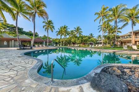 Enjoy sun-filled days at the lagoon-style pool—framed by swaying palms and just steps from your luxury townhome.
