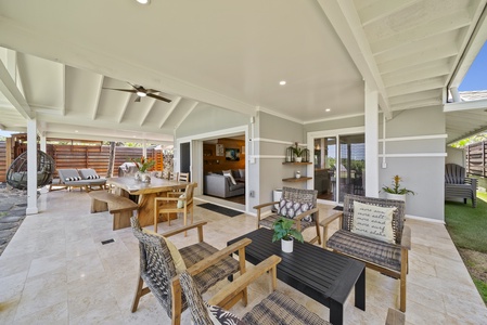 Cozy lanai lounge with easy kitchen access, perfect for relaxing after beach days.