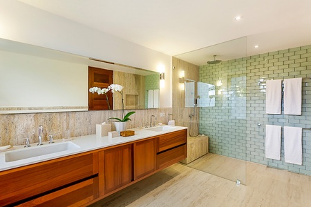 The expansive ensuite bathroom has dual vanities and separate shower.