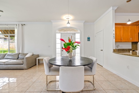 Elegant dining area featuring modern seating and a beautiful floral centerpiece to enhance your dining experience.