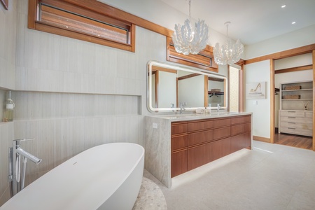 Luxurious ensuite primary bathroom featuring a standalone tub and modern fixtures.