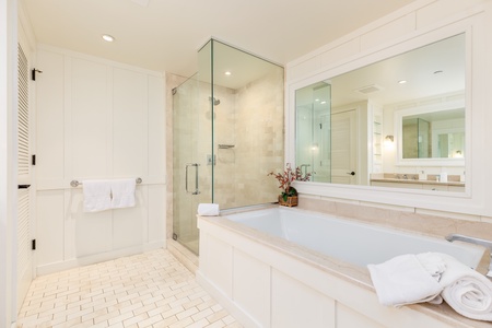 Deep soaking tub, separate shower and dual-sink vanity.