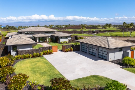 Stunning modern architecture set on championship golf course with lush tropical landscaping and mountain views.