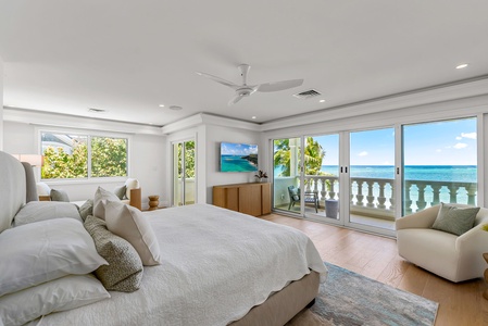 Primary suite with a king bed, two private lanais, and sweeping views of the Pacific for a serene start to each day.