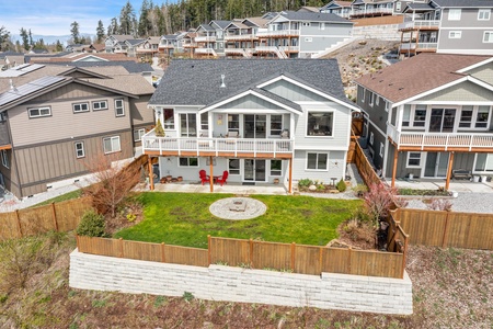 A seamless fusion of open living and dining spaces, with glimpses of the balcony's allure through expansive window panes