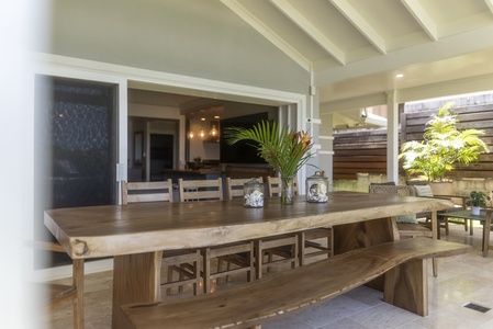 Long dining table for family-style meals after a beach day.